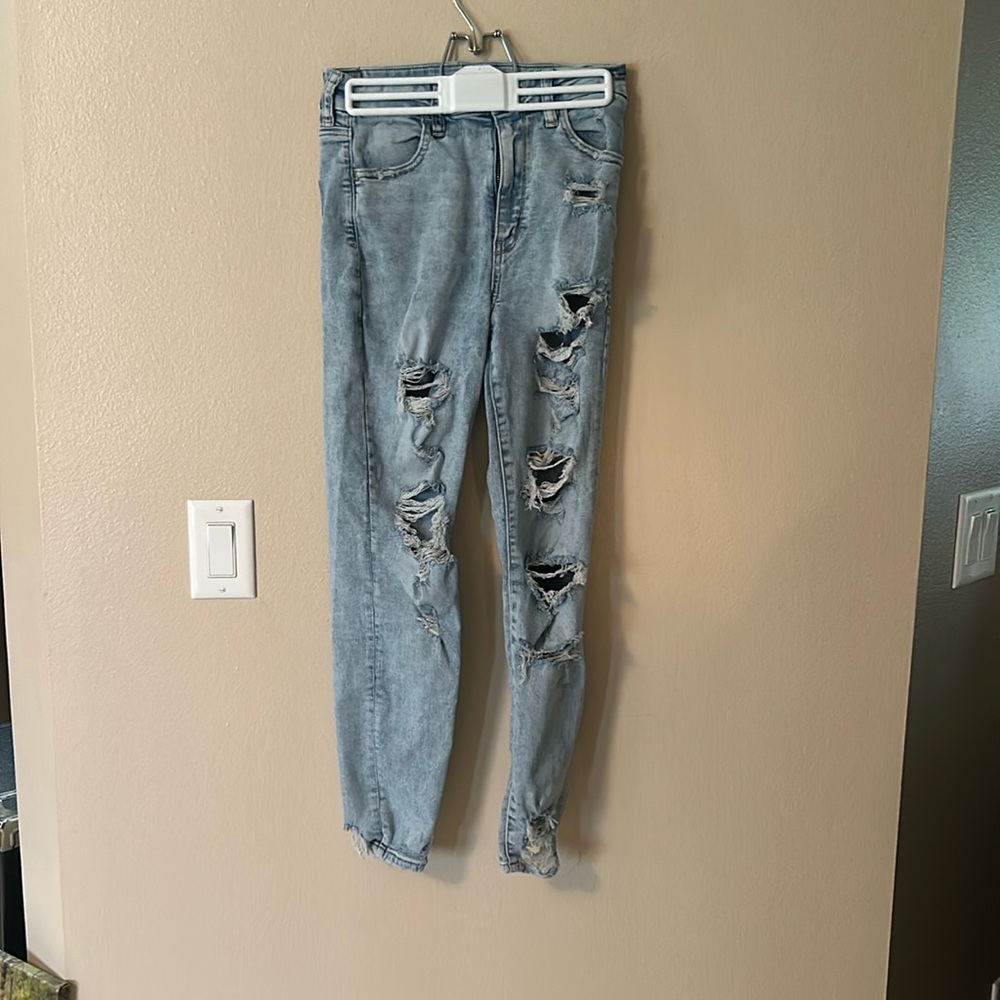 Ripped light wash blue jeans